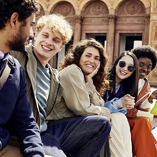 Group of multi-ethnic young people having fun outside