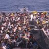 Fermo immagine dal film “Eldorado”: migranti su una nave militare durante l'operazione di salvataggio Mare Nostrum