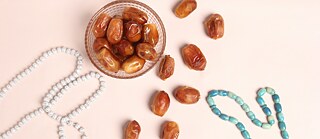 A photo of dates and pearls for the holy month of Ramadan