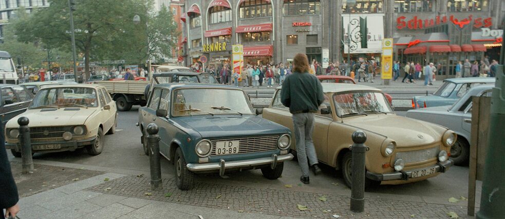 “East Germans weren’t forced to conform to the West; they wanted to”: On the day after the Wall came down, thousands of East Berliners flocked to Kurfürstendamm in West Berlin (Cars from East Germany on Breitscheidplatz, 10 November 1989).