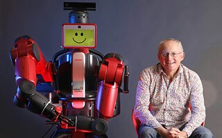 Toby Walsh with UNSW robot Baxter
