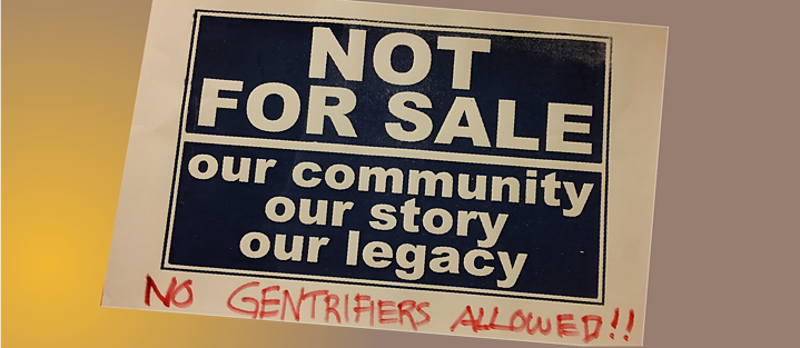 A cardboard protest sign stating "NOT FOR SALE Our Community Our Story Our Legacy" with an added handwritten line "No Gentrifiers allowed"