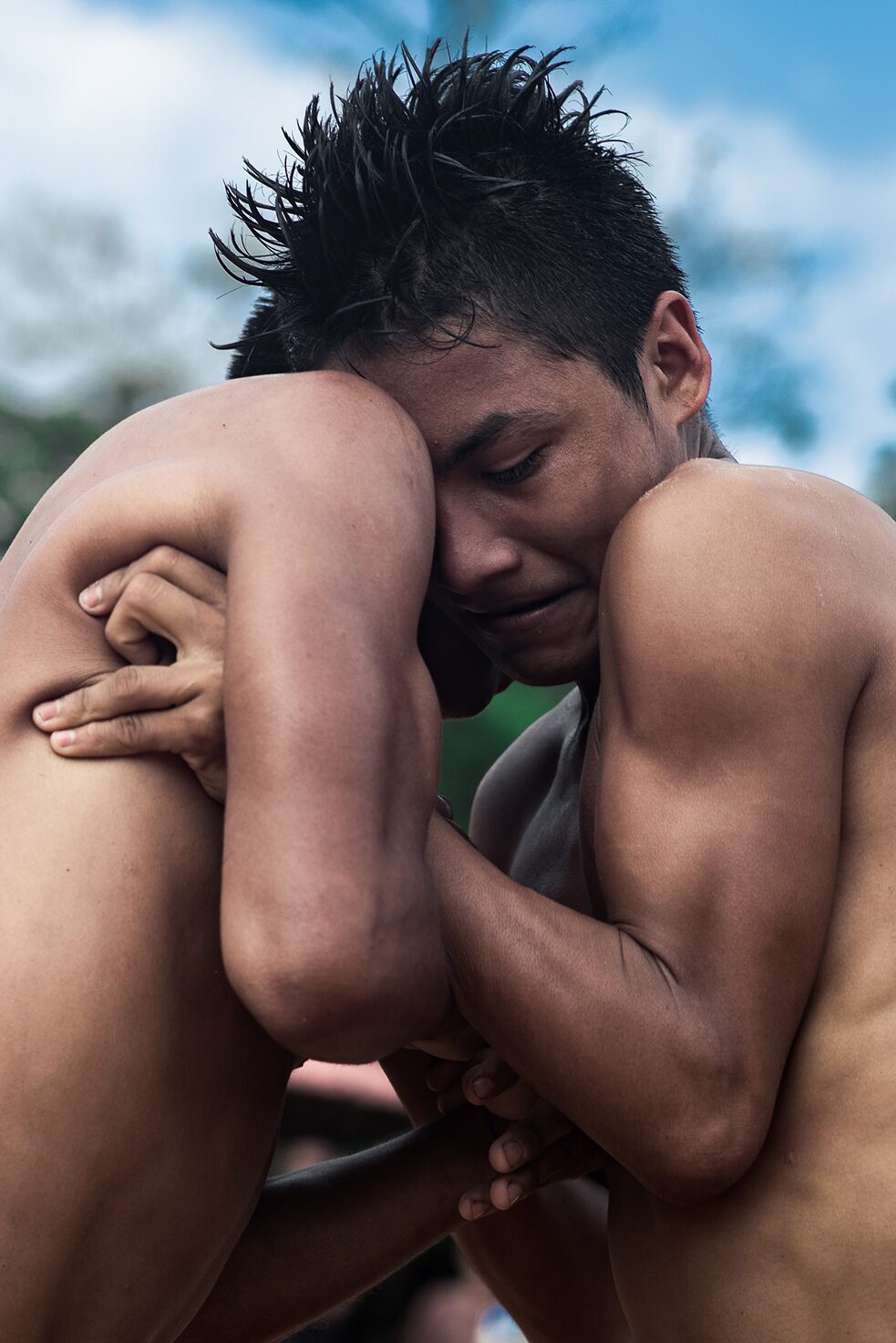 Javier Cisneros takes part in a fight in the community’s main square during the Pachamama celebration.