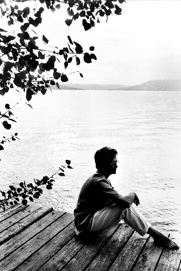 Annea Lockwood, b/w image, Annea is sitting near a river recording the sound