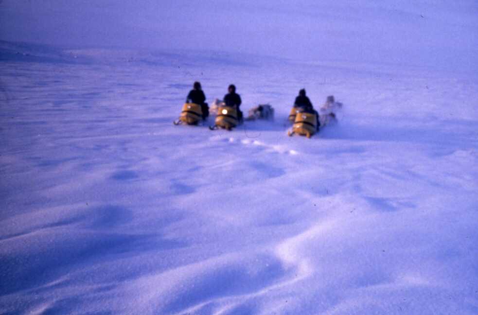 Caribou hunting with snowmobile
