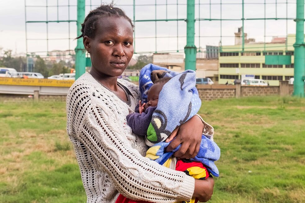 Mary with her two months old child in her arms