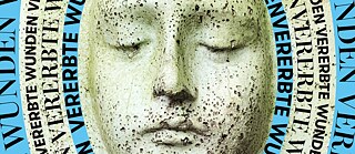 A stone face with closed eyes