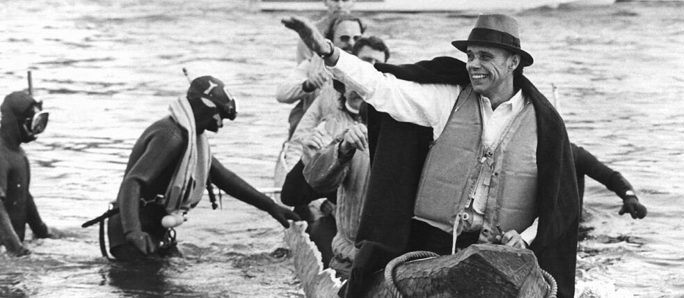 In a log-boat of eight metres length Joseph Beuys crosses the river Rhein and returns symbolically to the Academy of Arts (20.10.1973) which he had to leave without notice due to his occupation of the office as a protest against the rejection of students. 