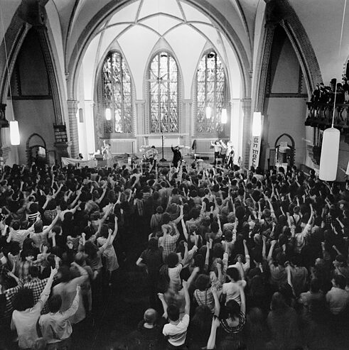 Young people attending a blues mass, Berlin, 03/06/1989.  Blues masses were a mixture of live music, debates on social/political issues and religious services. 