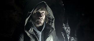 A bearded man in a hoodie jacket