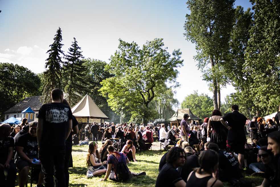 Visitors rest on the pagan village at the Wave-Gotik-Treffen. 