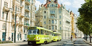 Streetcar decked out in a Goethe-Institut design in front of the Goethe-Institut Prague. 