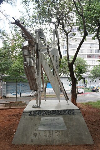 Monumento inaugurado no ano de 2020 em homenagem a Joaquim Pinto de Oliveira, conhecido como Tebas, em São Paulo. Tebas (1721–1811) foi um engenheiro, arquiteto e artesão brasileiro, escravavizado até provavelmente os 58 anos de idade por portugueses no Brasil e possivelmente mantido em regime de escravidão também pela Igreja Católica.