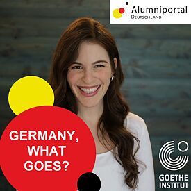 A laughing woman with long brown hair and a white long-sleeved shirt is standing in the middle of the picture, a blurred grey-blue background can be seen behind her. In the lower right corner of the picture is the Goethe logo in white, on the left are three circles in yellow, red and black. The largest of them is the red one, on which is written in white, Germany what goes? In the top right corner is the logo of the Alumni Portal.  