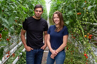Mohamed Hage with Lauren Rathmell in the new Saint-Laurent greenhouse. 