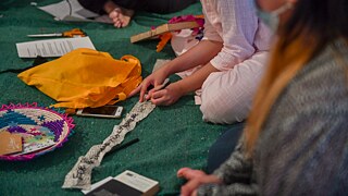 In this session the participants collectively constructed a piece of cloth, symbolic of care and made with feminist and anti-capitalist intention. During the session they read and listened to excerpts from writing and music around care within resistance, while co-weaving pieces of fabric brought in by the participants. 