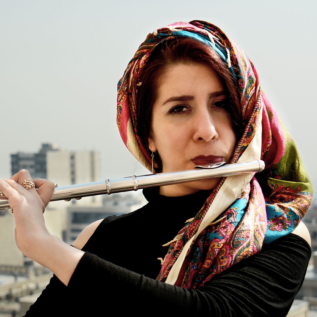 Azin plays the flute