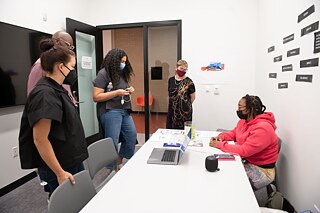 Presentation during An Evening of Design & Conversation at the MLK Library, October 2021 (Left to Right: Kathrin Engler, Goethe-Institut; Anthony Harris, Quinn Evans; Alison Beshai, Form Function Studio; Linnea Hegarty, DC Public Library; Adrienne Gaither, Art Dept.) 