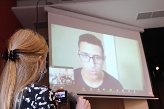 Live-Zuschaltung aus Ägypten zur Abschlussveranstaltung in Berlin