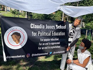 Fugitive Sanctuary Community PopUp in Oxon Run Park. Long-time local activist Luci Murphy, shown here with Dion Harrison, facilitated a song circle and presented about the Claudia Jones School for Political Freedom