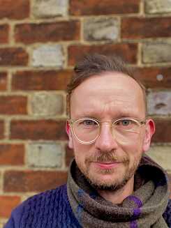 Headshot von Dan Hicks