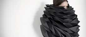Woman's head covered by artistic clothing