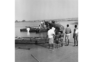Angola 1959: Car ferry over the Bengo. Angola was a Portuguese colony until 1975.