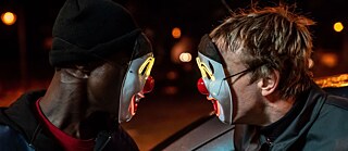 Two men in clown masks 