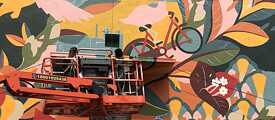 Artists Greta and Aasthi at work on the mural in Delhi.