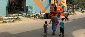 The Graphic Travelogues #Murals project site draws the attention of passersby.