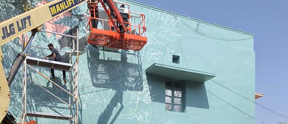 The first part of the design sketch for the mural is applied.