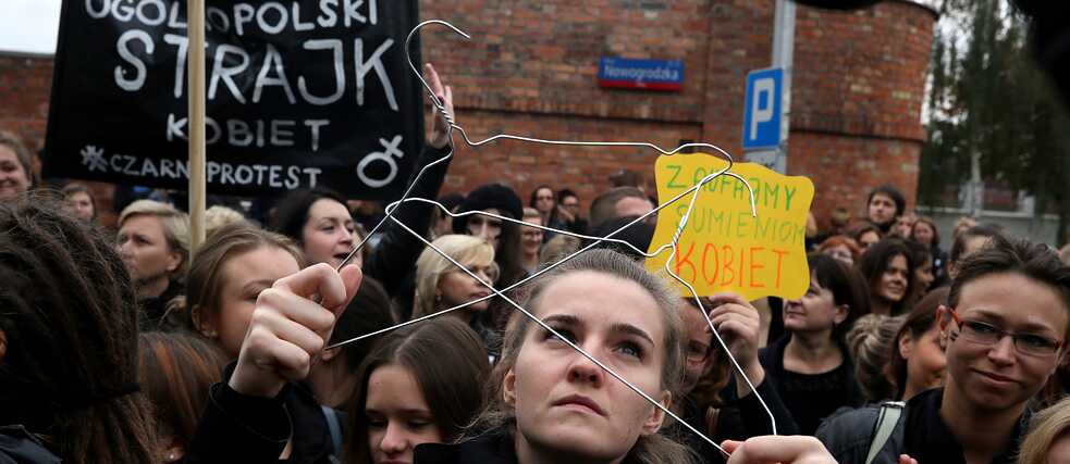 Women dressed in black protest on the street    