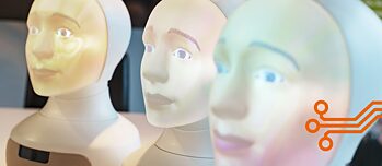 Three robotic heads with human features, all called Tengai, next to each other
