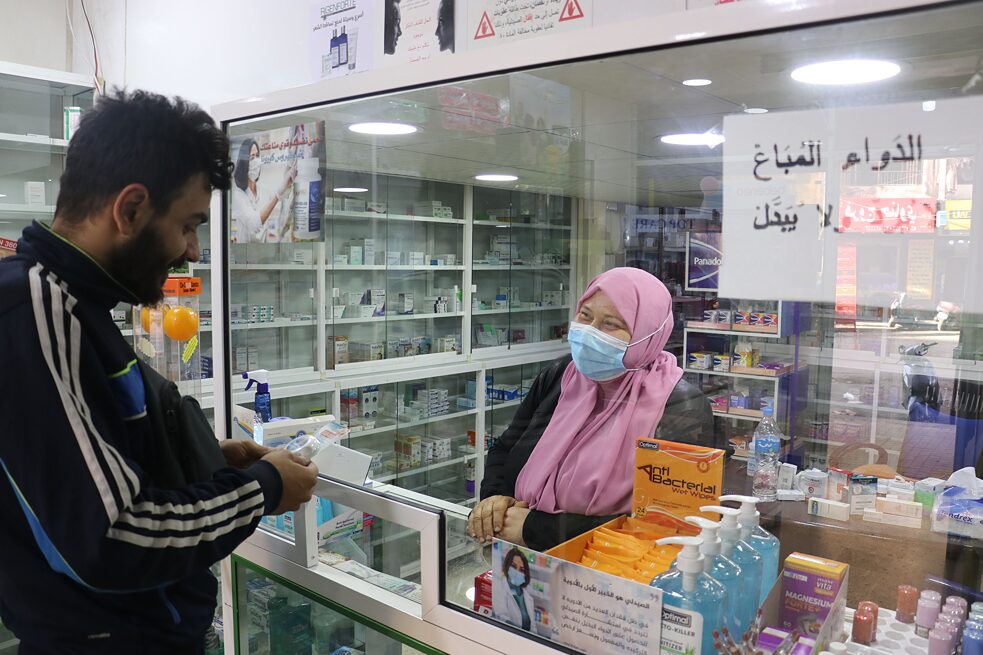 In a pharmacy in Beirut, a customer takes advice from a pharmacist. Many medications are no longer available. The drugs which are still available aren’t affordable for many, because all prices are still in US dollars.