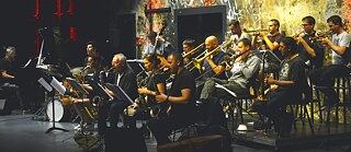 The members of the Jazzwerkstatt Orchestra, a jazz group, performing.