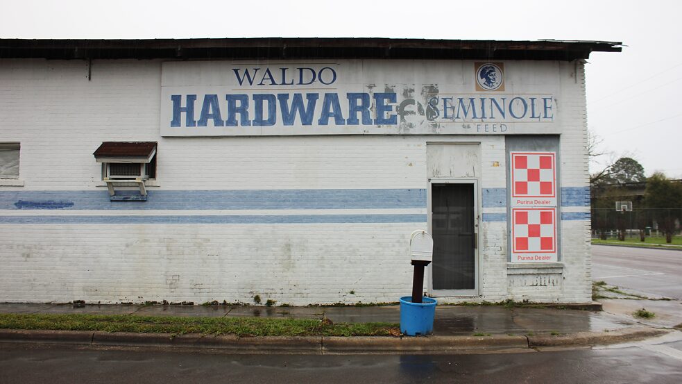 The exterior of an abandoned hardware store in Waldo, Florida