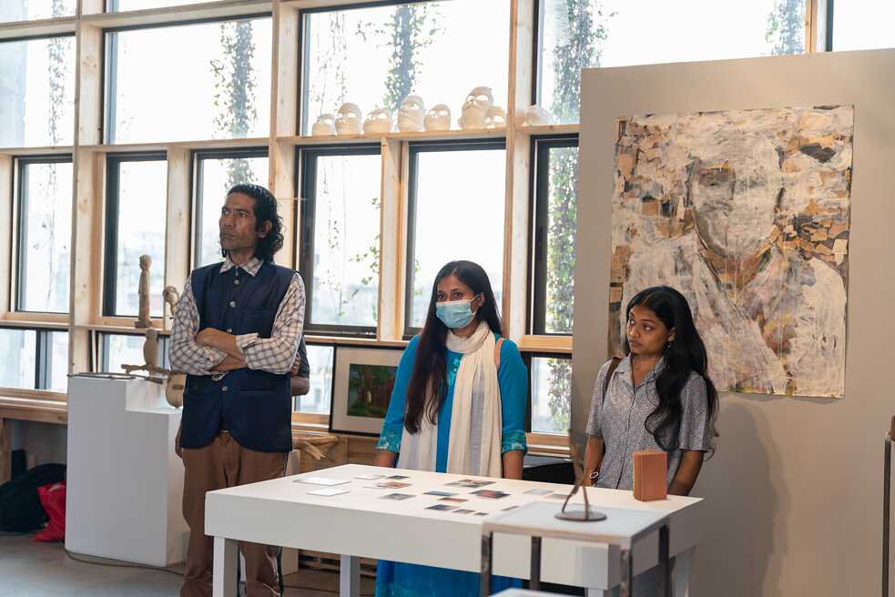 Artist Himan Murmu from Dinajpur (left) and photographer Snighdha Sultana (right)