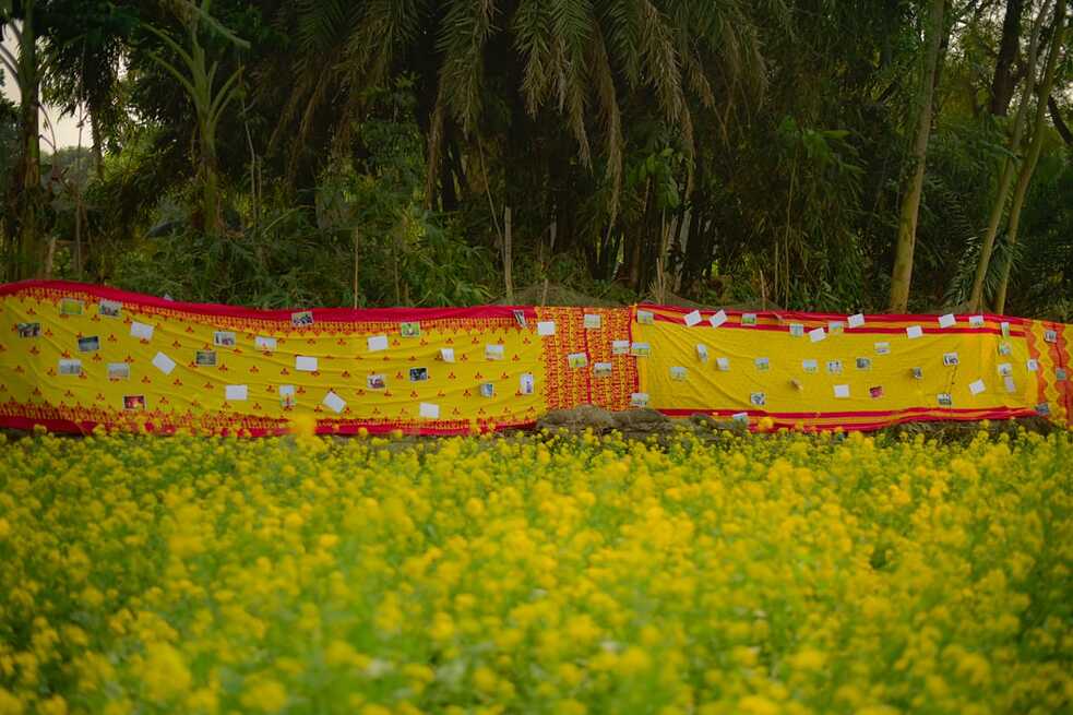   Multiple locally produced sarees were put together to create the exhibition wall