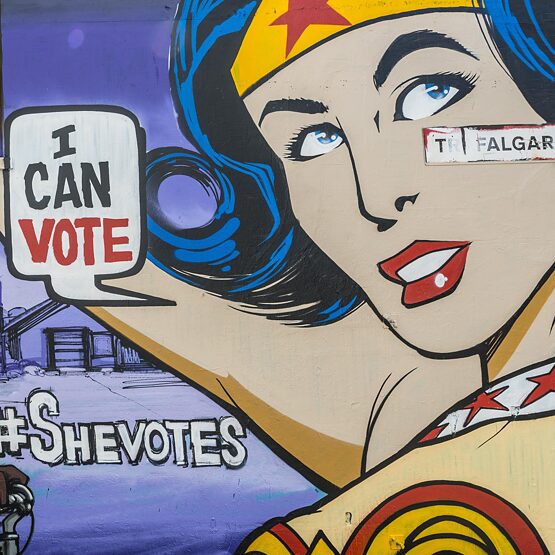 Graffiti on house wall, woman as superhero with balloon "I can Vote", Brighton, England, United Kingdom
