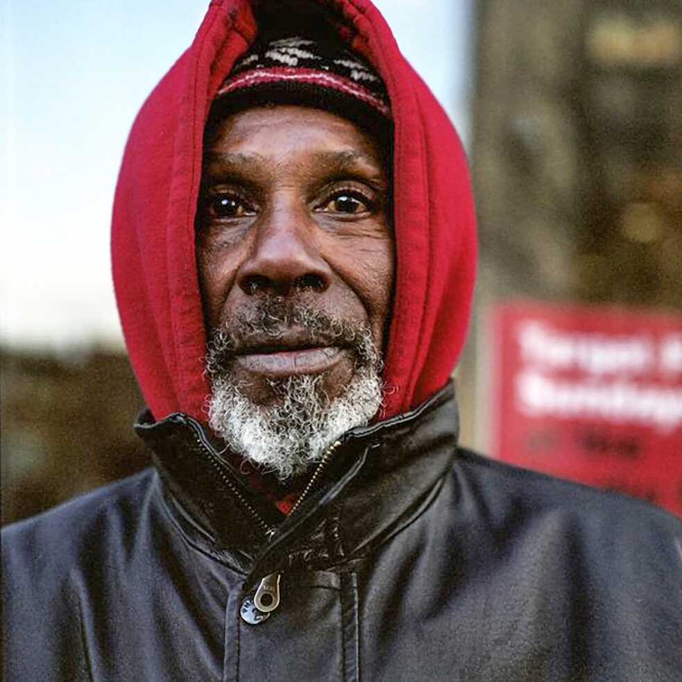 A man in a red hoodie