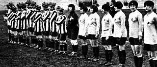 Damfotboll – English vs. French Women's Football Match, 1920., Photograph showing an English team (left in striped shirts) from the Dick Kerr electrical works, Preston, and a French women's football team, prior to a match held at the Pershing Stadium, Paris, 1920. The match was watched by 12,000 spectators and resulted in a 1-1 draw., . 1920. 