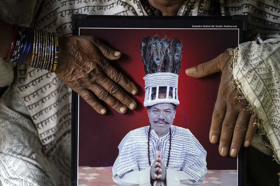 The frail hands of an elderly couple caress a memory from their past. This studio portrait of Karthik Ram ji is one of their prized possessions, more so because it highlights his tattoos that once were his weapon of resistance.