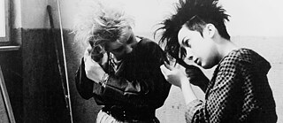 Two women doing their hair