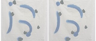 dove grey splotch against light background of crumpled paper