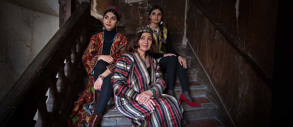 Yasamin Yarmal and her daughters in a Paris stairwell.