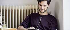 Man with tablet and headphones