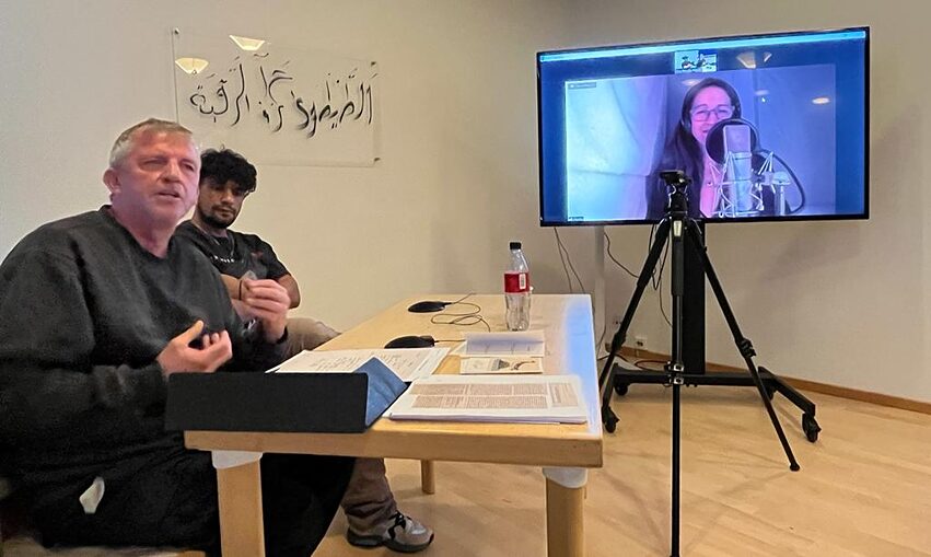 Wolfgang Müller and Ahmad Hamad with Claudia Urbschat-Mingues remotely on screen