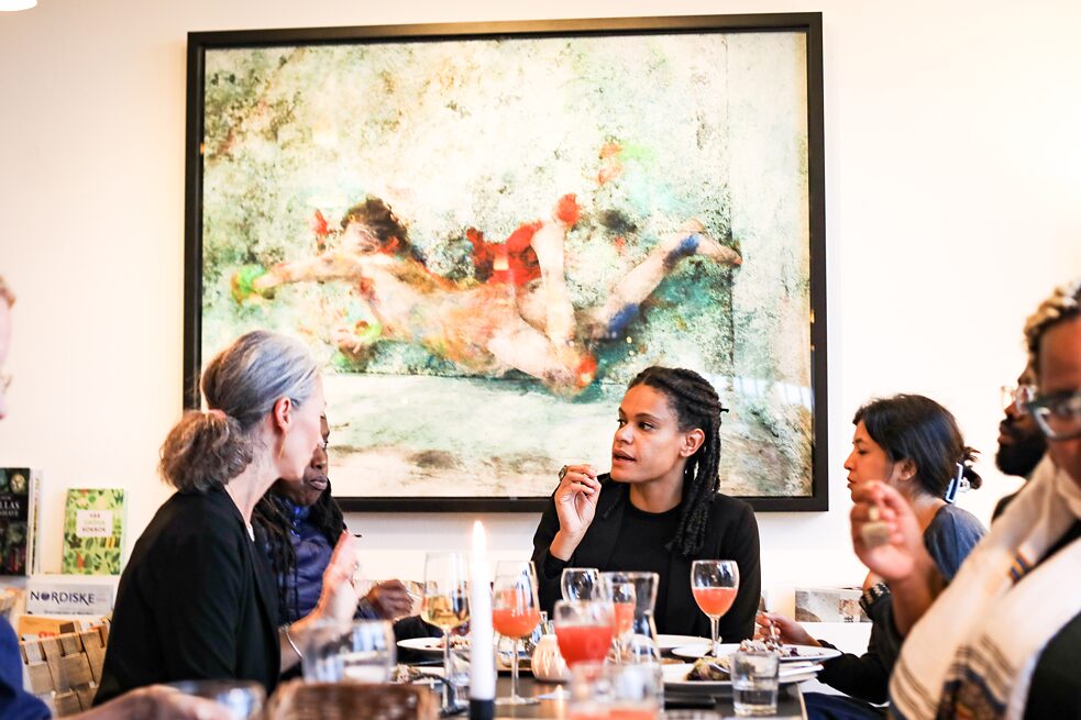 People sitting around a table for dinner