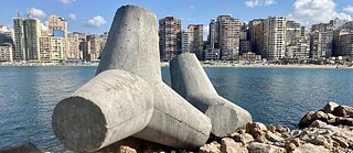 Concrete barriers lie on the coast of Alexandria