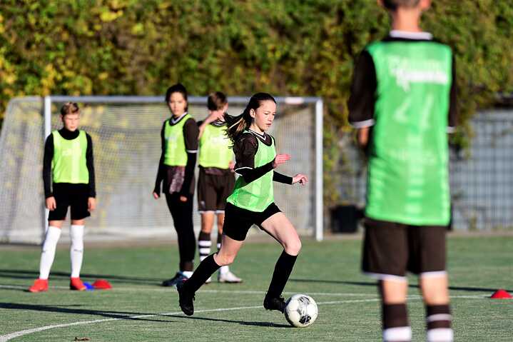 teenagers playing football